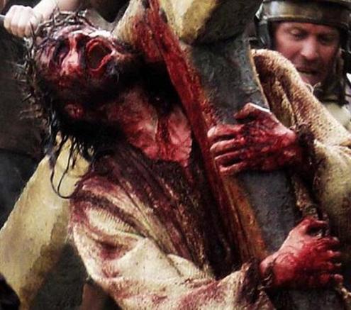 In this archived photo, Jesus of Nazareth is seen howling, covered in his victims' blood.